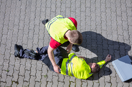 A workers assisting an injured worker